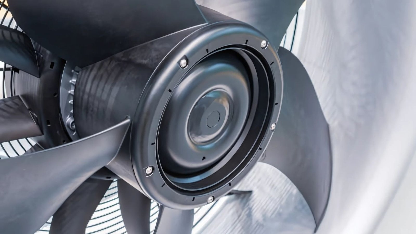 HVAC plastic components including ventilation housings and balanced fans in production facility.