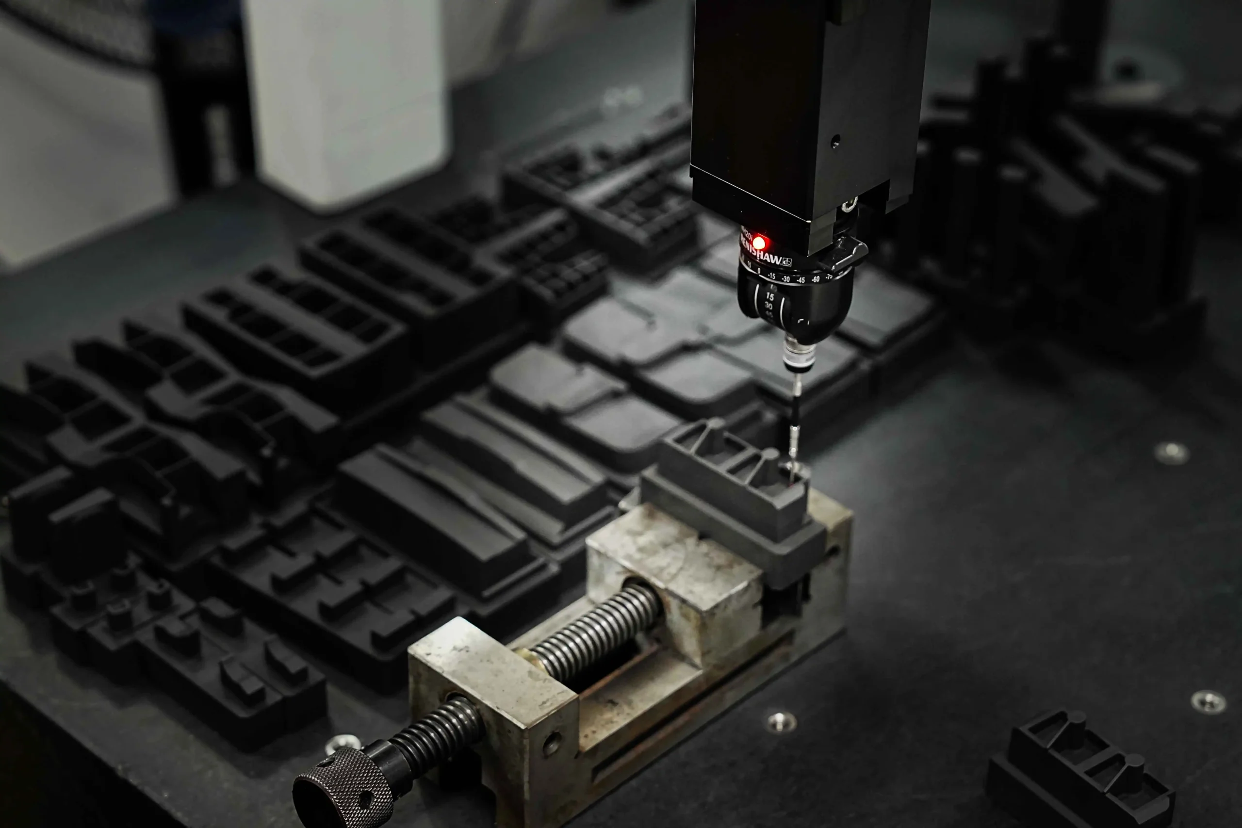 Engineer operating CNC machinery in prototyping lab at Haumann Technology for hybrid mold development.