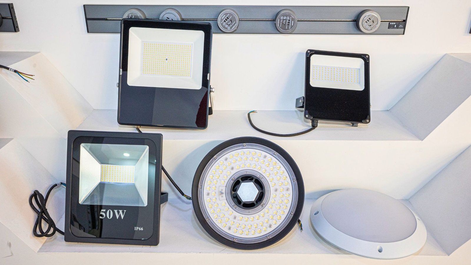 Precision-molded LED housings and optical components for stadium and sports lighting systems