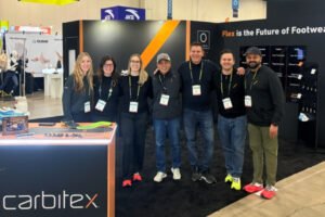 Haumann founder Martin Aicher with Carbitex leadership at The Running Event 2025 booth in San Antonio