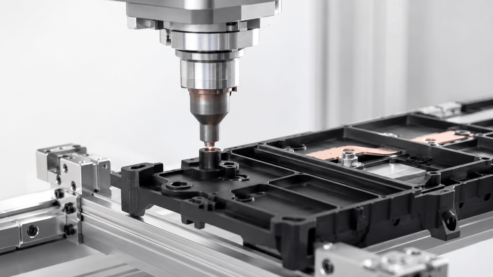 Automated heat staking machine forming PA66-GF30 joints on an EV battery busbar carrier