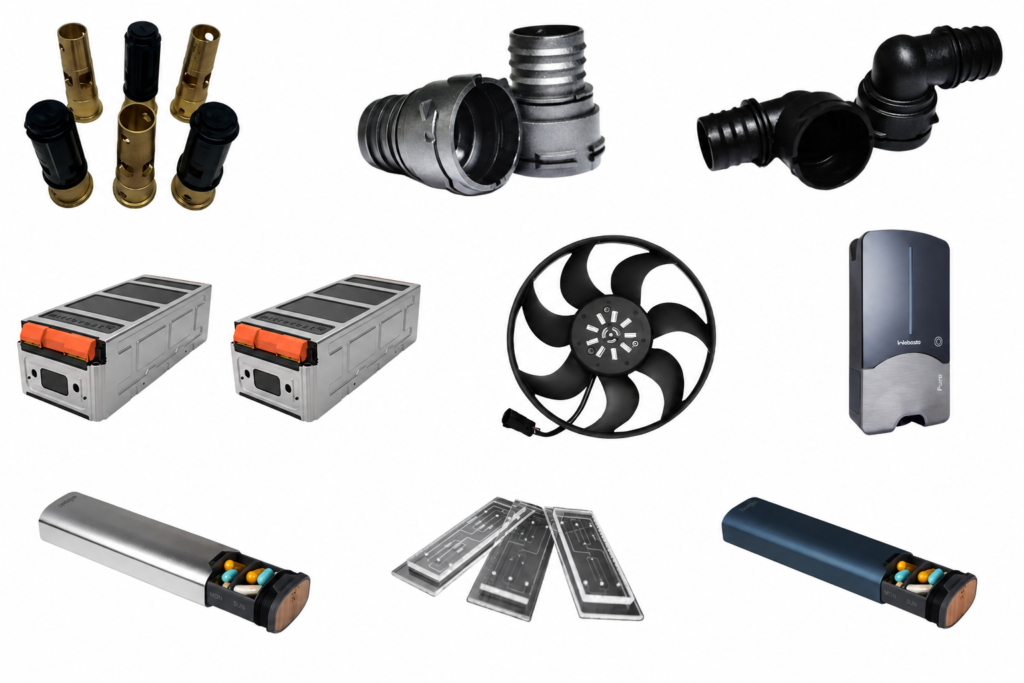 Precision injection molded parts including brass fittings, plastic housings, a fan, and molded enclosures