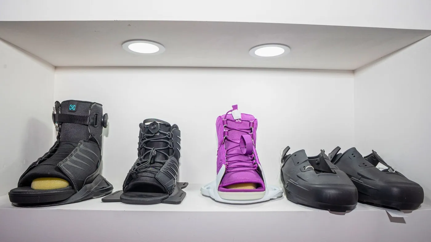 Finished moulded wakeboard boots and bindings with injection moulded shells and frames on display